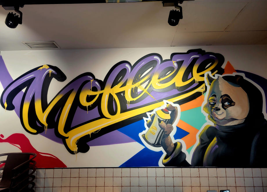 Panda bear graffiti created by @mawearte and @paucda_ for the Moflete by Joe Burger burger joint in Madrid, Valencia and Cuenca